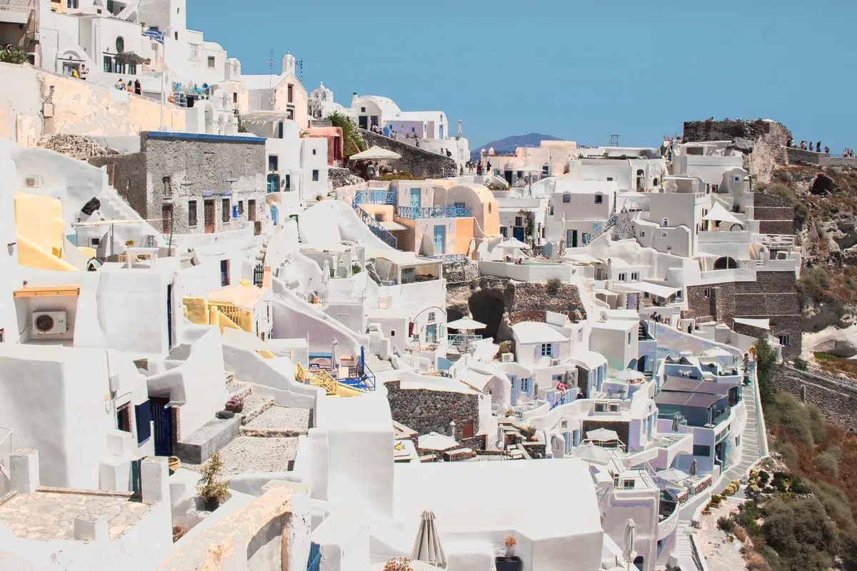 White houses under a blue sky in Greece